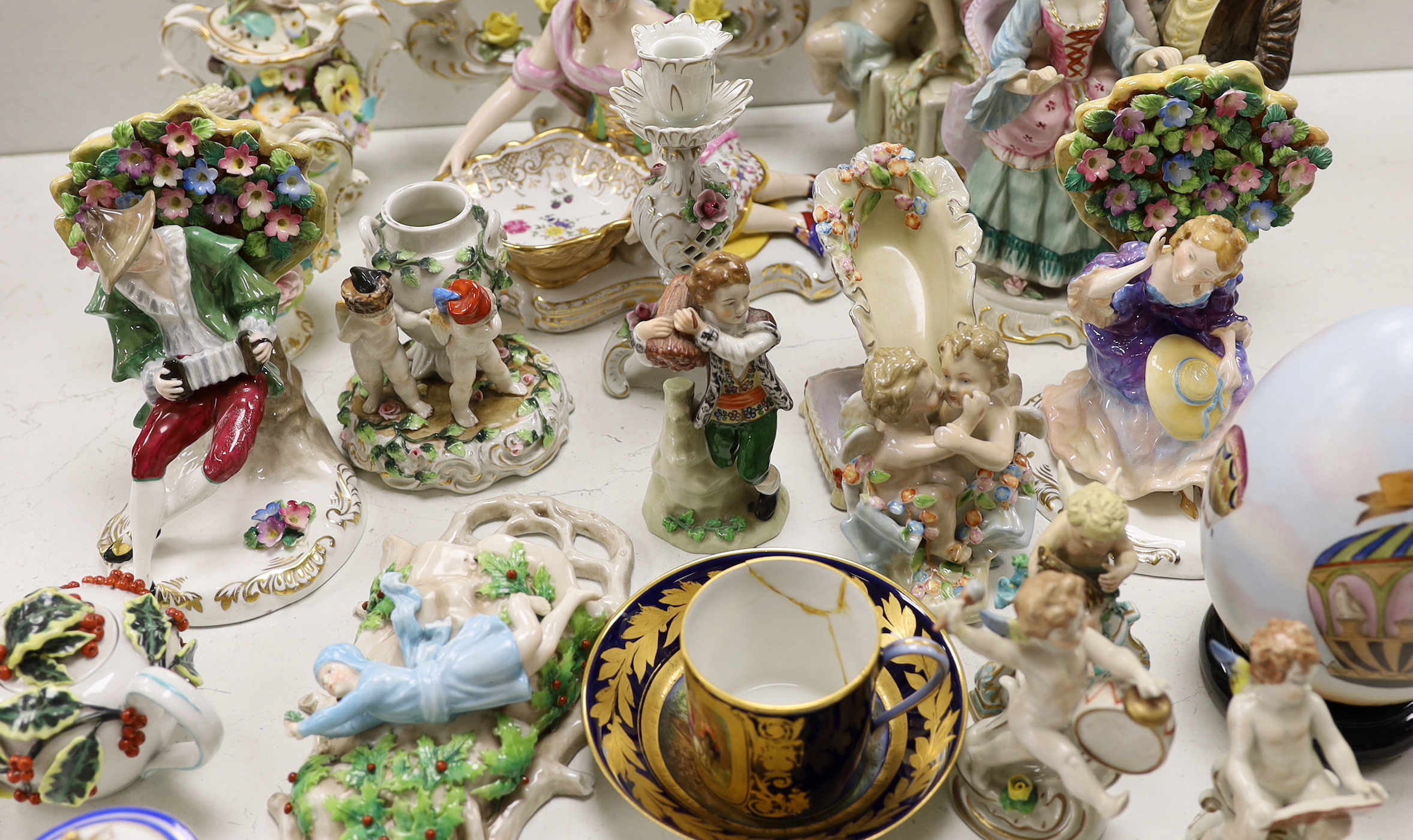A large group of mainly continental table wares and figurines
